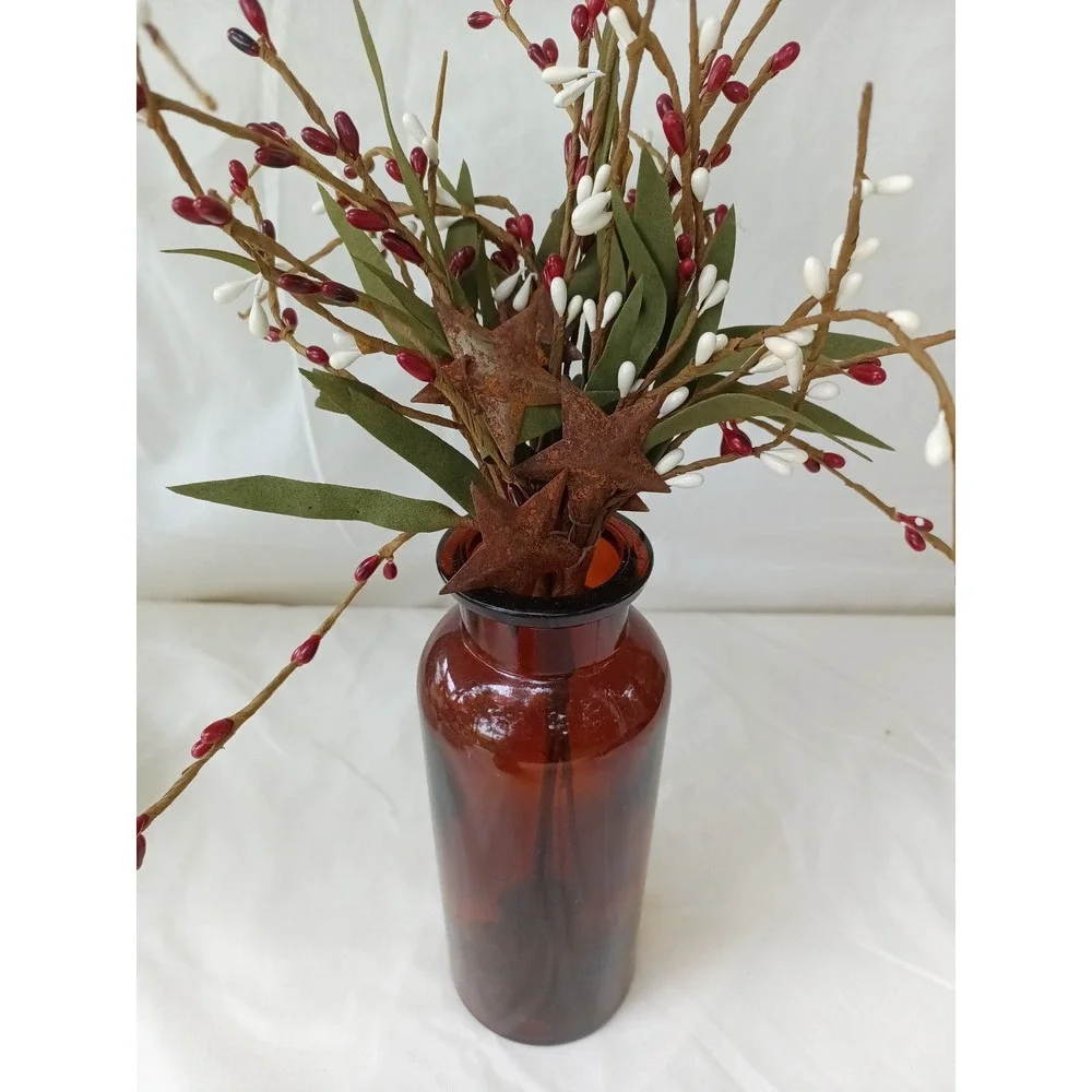 Amber apothecary bottle with red white pip berry pic w rusty stars